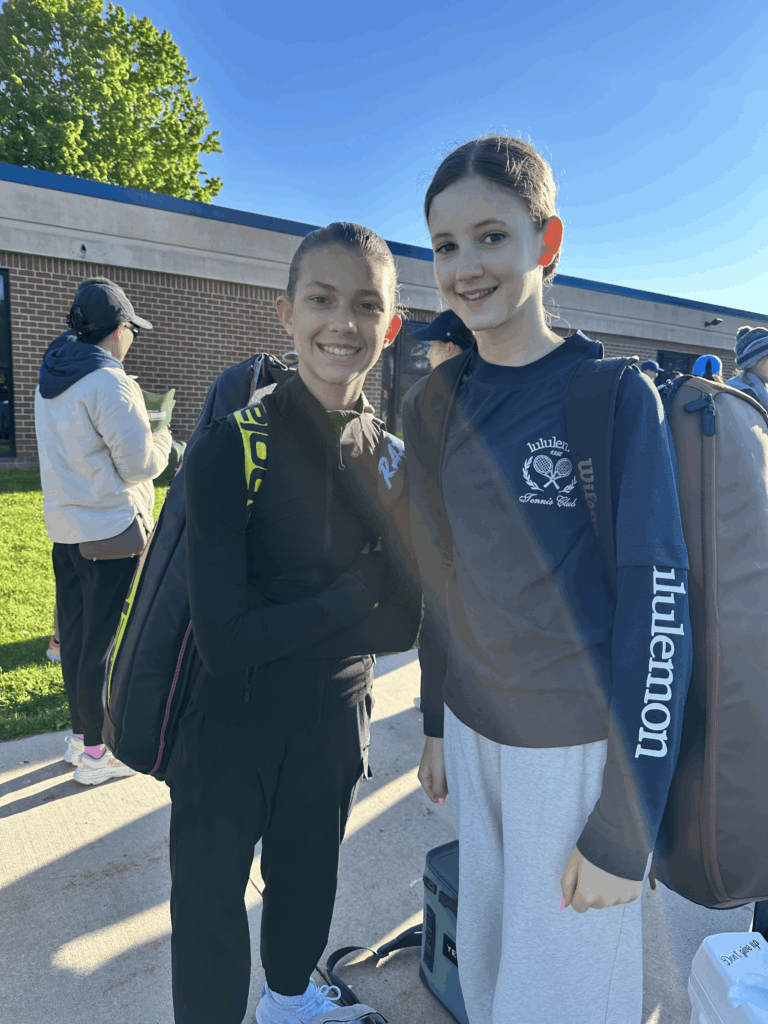 Tennis players outside smiling