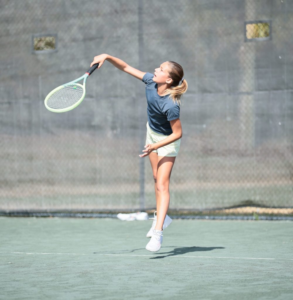Girl holding tennis racket
