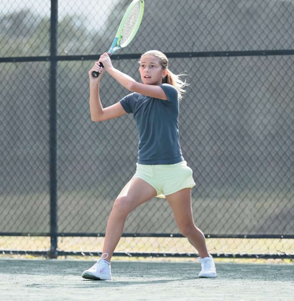 Youth girl with tennis racket