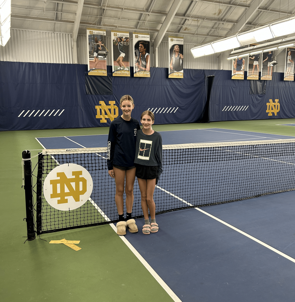 Female tennis players standing on tennis court