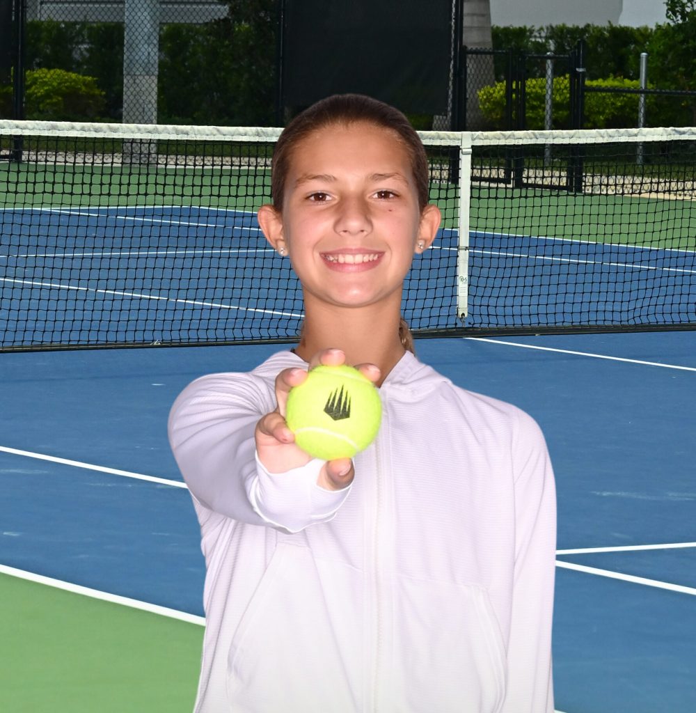 Maeryn IMG Camp 2 – 082024 Youth tennis player holding tennis ball